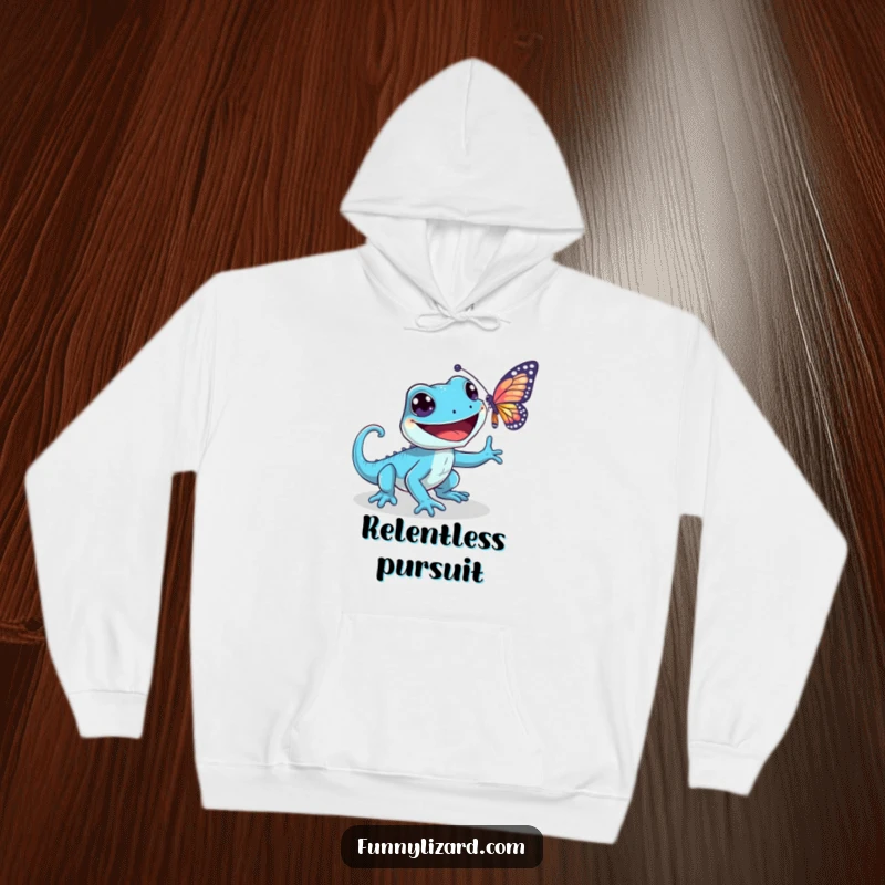 Funny blue lizard hoodie, depicting a playful lizard with a wide grin chasing a shimmering butterfly, perfect for cool weather.