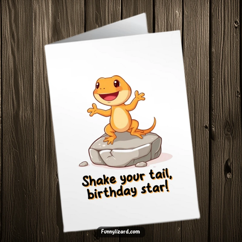 Funny Free Printable Birthday Card: Happy orange lizard with short legs doing a joyful jig on a rock, celebrating a birthday with enthusiasm.